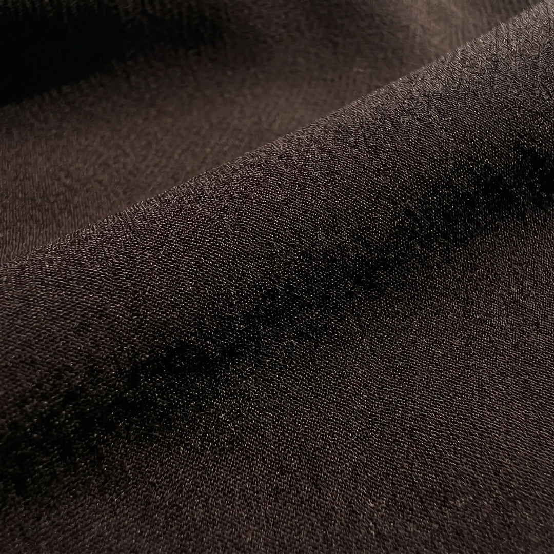 Close-up of the rich espresso brown chiffon fabric for the Kryzen mini dress, highlighting its fine texture and elegant drape.