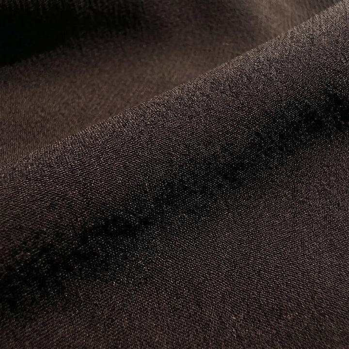 Close-up of the rich espresso brown chiffon fabric for the Kryzen mini dress, highlighting its fine texture and elegant drape.