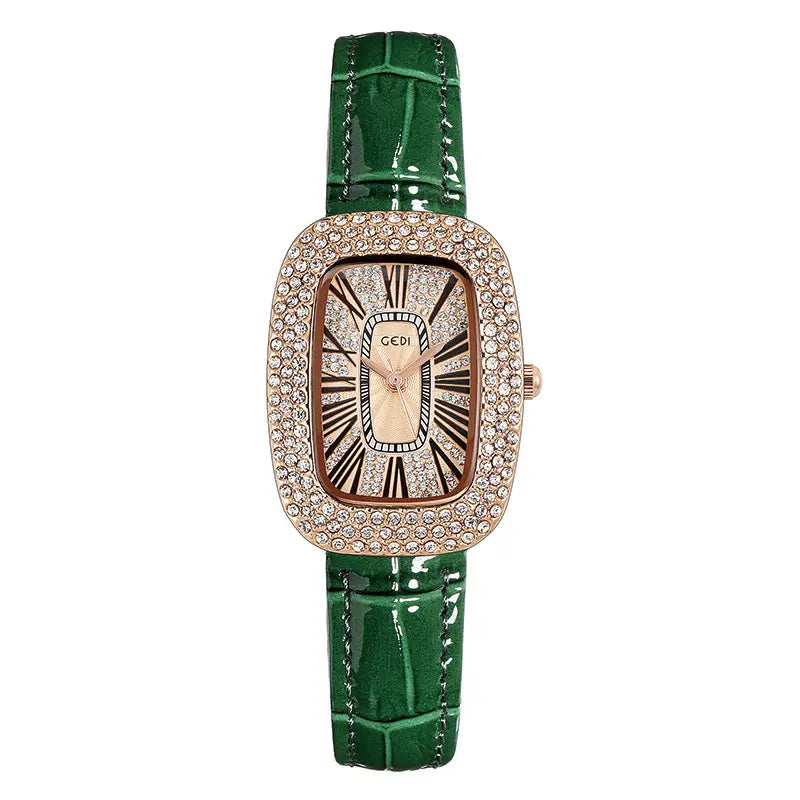 Oval rose gold-toned watch featuring a crystal-embellished bezel, champagne sunburst dial with Roman numerals, and a green alligator-embossed leather strap.