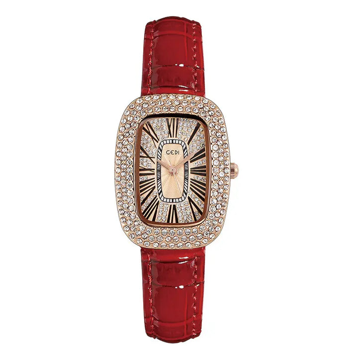 Elegant oval rose gold watch with a sparkling crystal-embellished bezel, a champagne sunburst dial featuring Roman numerals, and a glossy red alligator-embossed genuine leather strap.