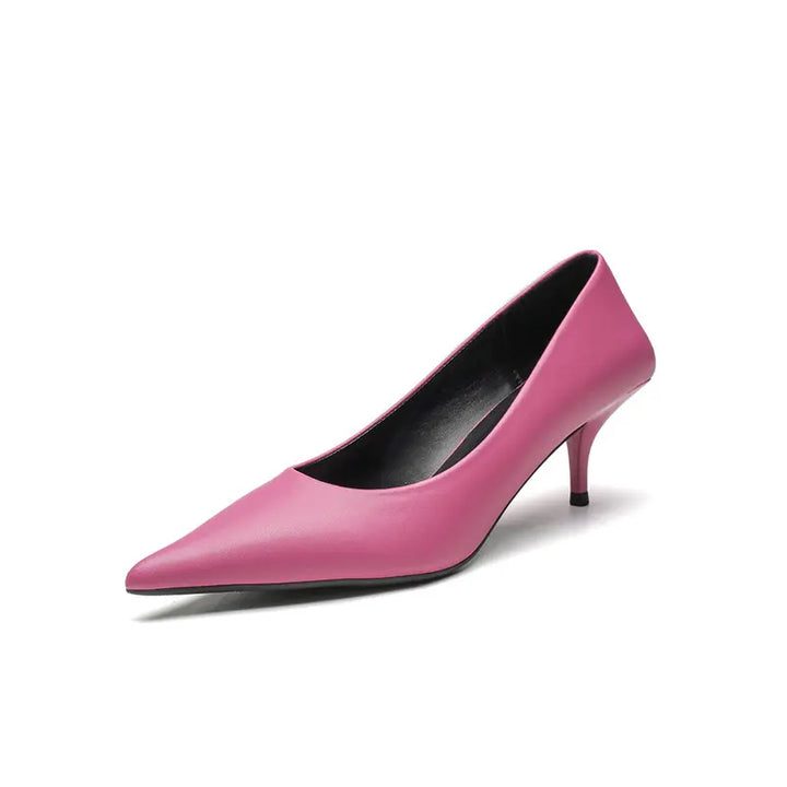 Vivid green high-gloss faux leather stiletto heels for women, featuring a sharp pointed toe, low-cut vamp, and a slender stiletto heel with a sculpted base. This studio shot showcases the shoe from a front three-quarter angle on a clean white background.