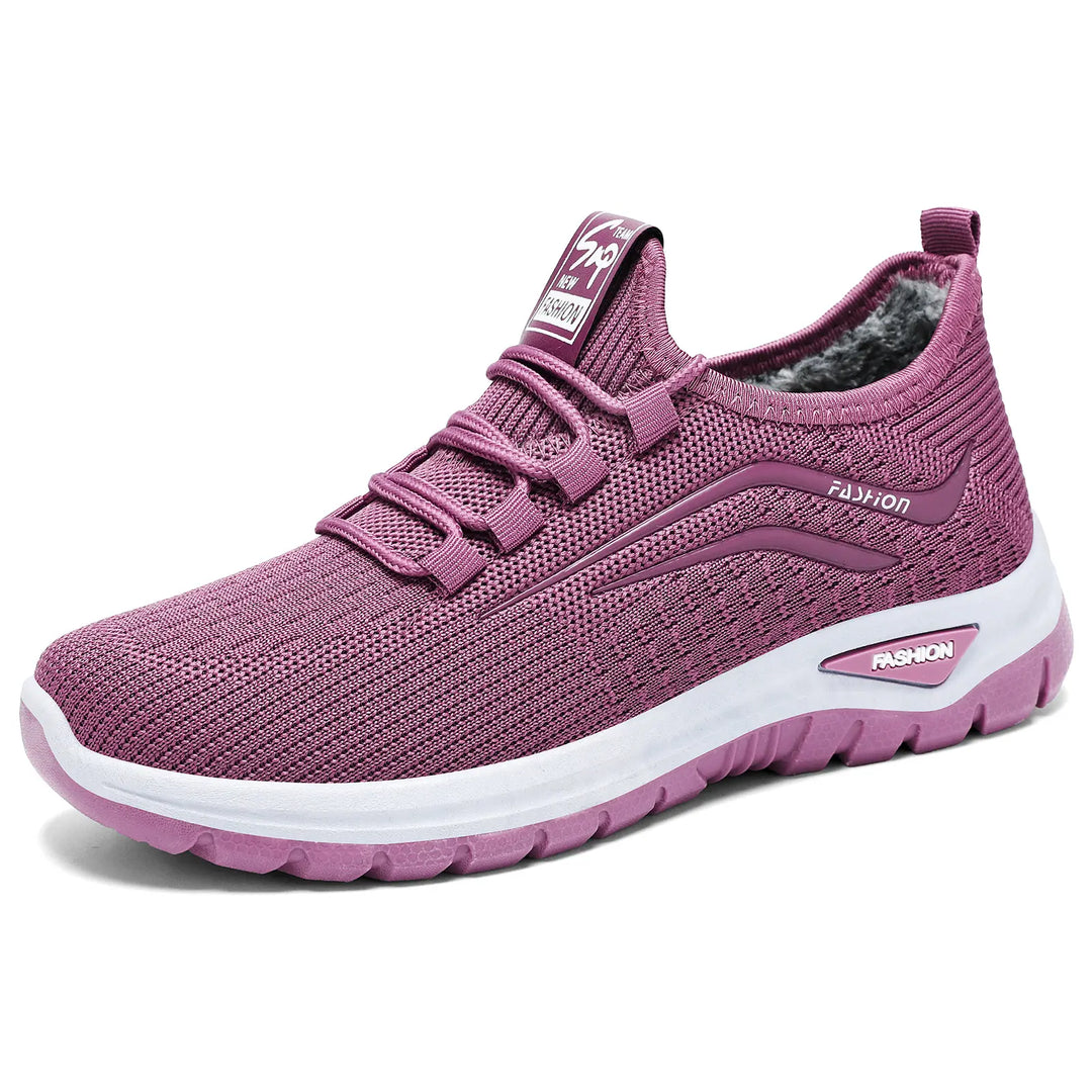 Amethyst purple knit winter sneakers with plush fleece lining, white midsole, and matching purple outsole, shown from a three-quarter angle.