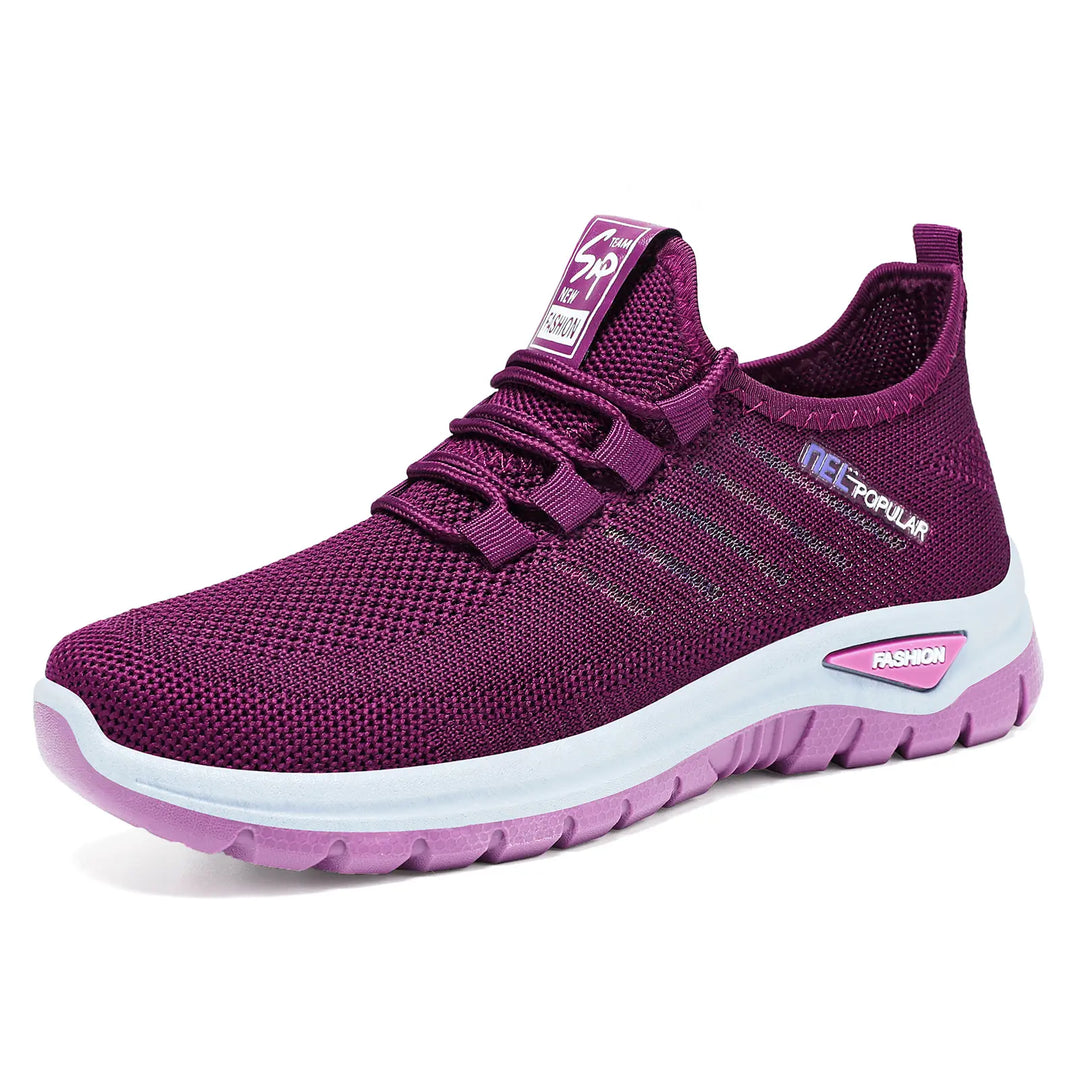 Purple lightweight breathable knit sneakers shown in a three-quarter front view, featuring a white side stripe with &