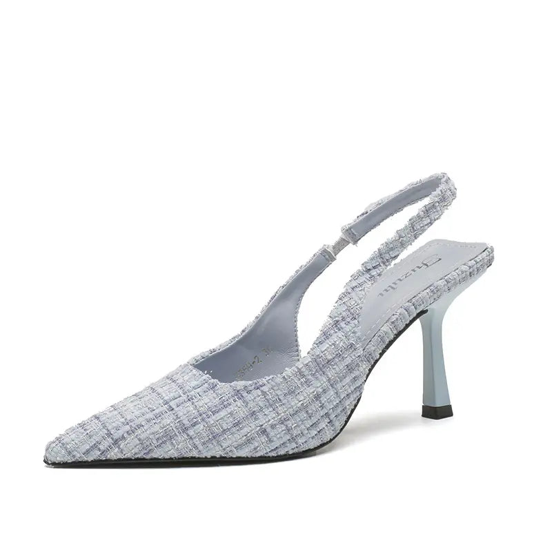 Qalani pale mint green pointed toe slingback heels crafted from textured woven fabric, featuring a slender 7cm stiletto heel and adjustable buckle strap.