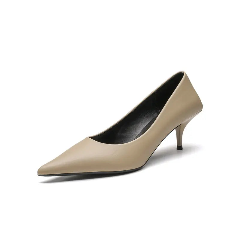 Qanari light beige high-gloss faux leather stiletto pump with a sharp pointed toe and sculpted heel, displayed from the front.