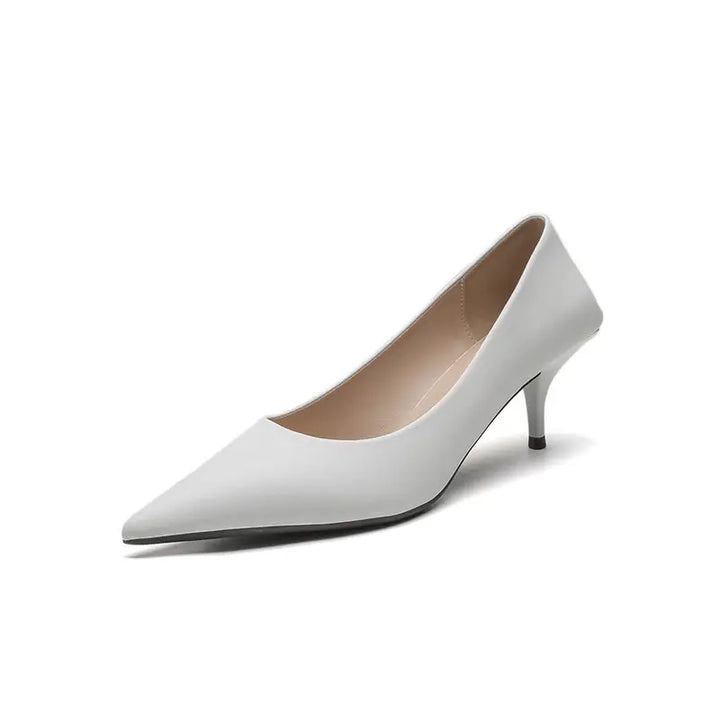 Front view of a white Qanari stiletto heel made from high-gloss faux leather with a sharp pointed toe and low-cut vamp. Features a slender stiletto heel.