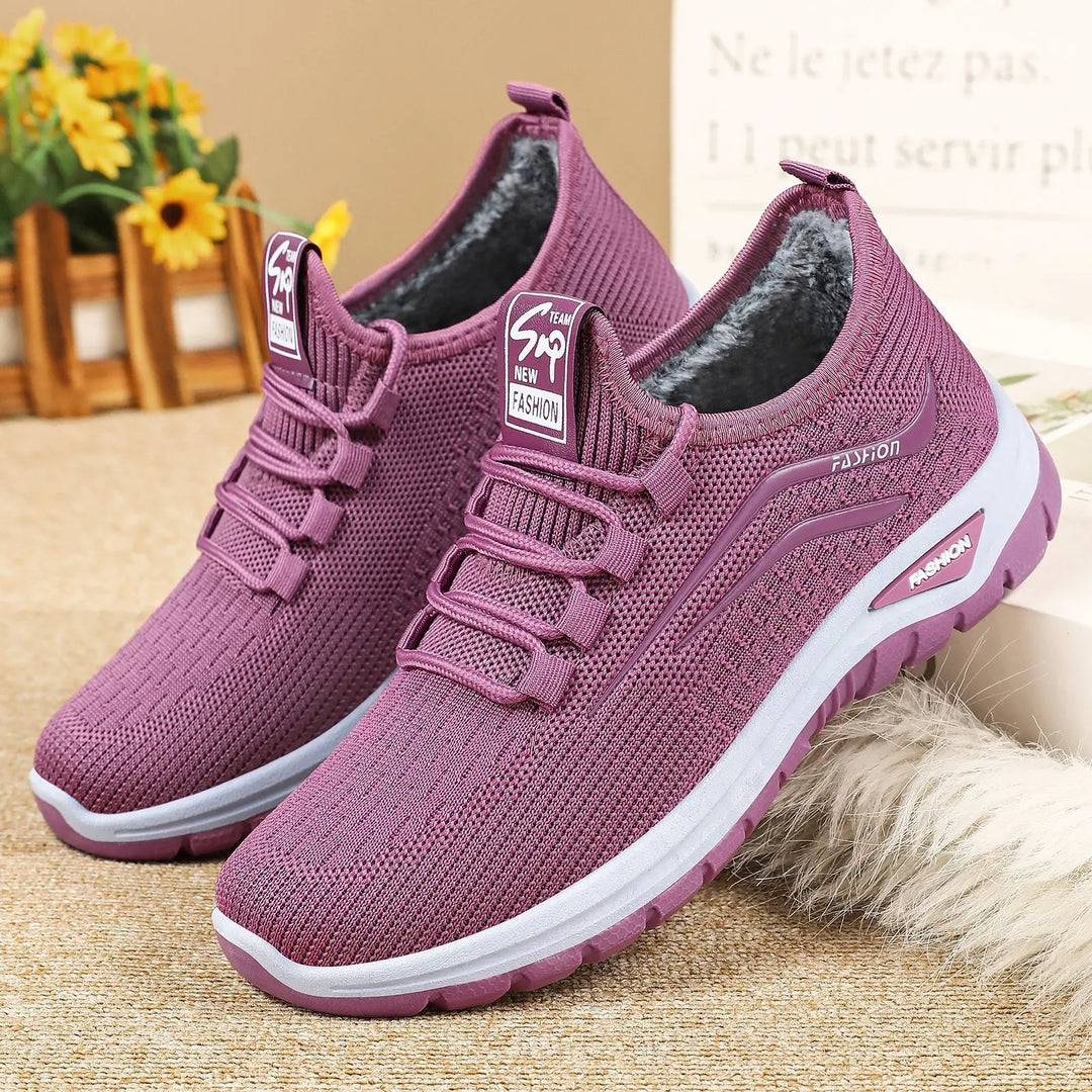 Amethyst purple fleece-lined knit sneakers shown from a three-quarter angle, featuring a white midsole and purple outsole, with 'FASHION' text on the side.