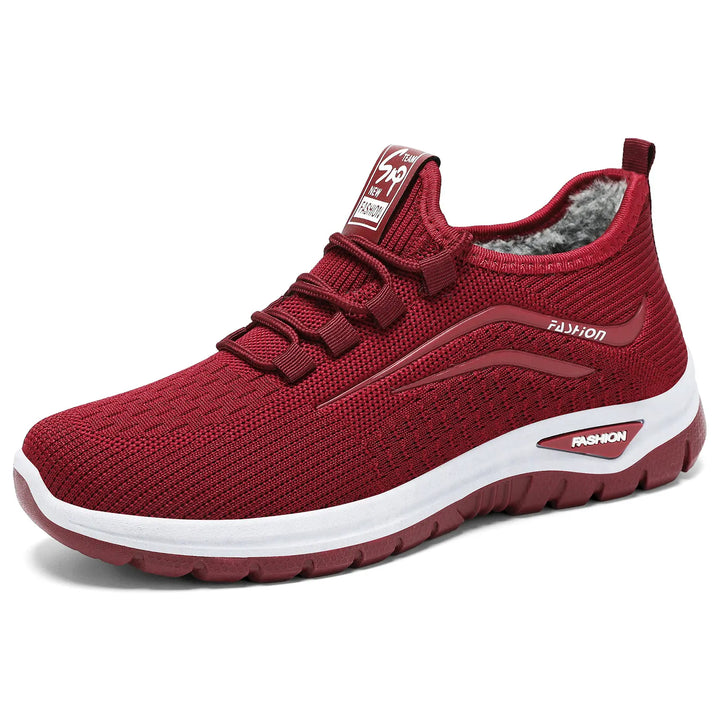 Qorto red knit fleece-lined winter sneakers shown from a three-quarter angle, featuring a white midsole and rubber outsole, with &