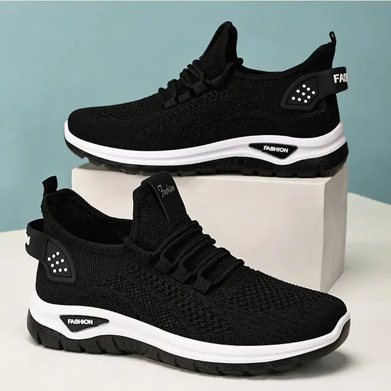 Black Raxen breathable mesh sneakers with white soles and grey &