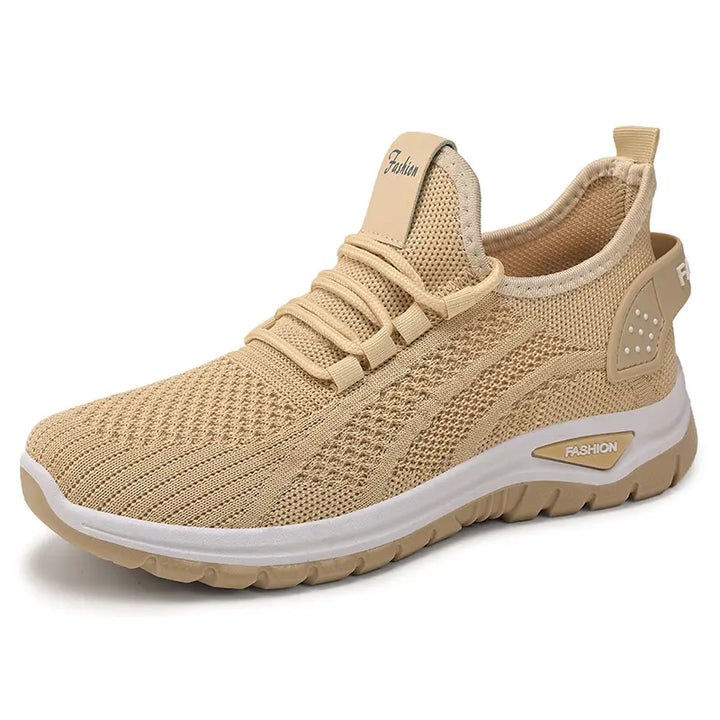 Oat beige Raxen breathable mesh sneakers with a white sole and grey heel accent, displayed in a three-quarter front view on a clean white background.