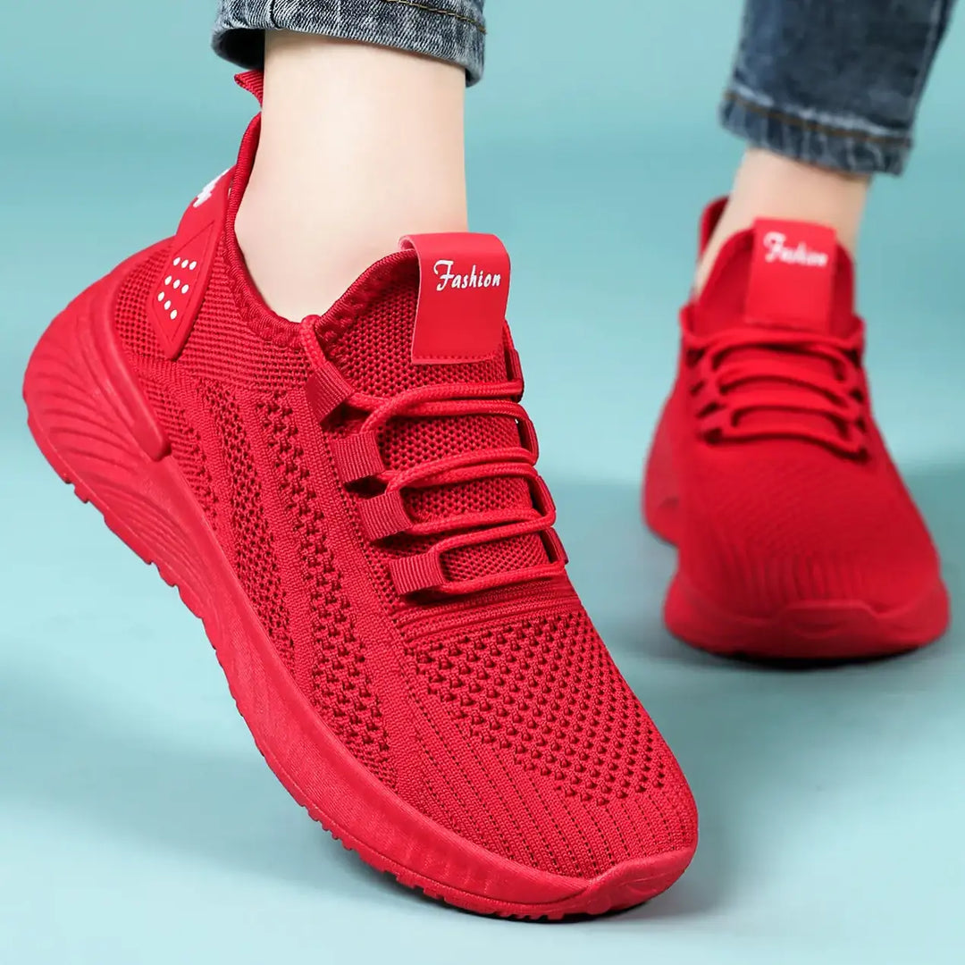 Pair of vibrant red Kaelen women&