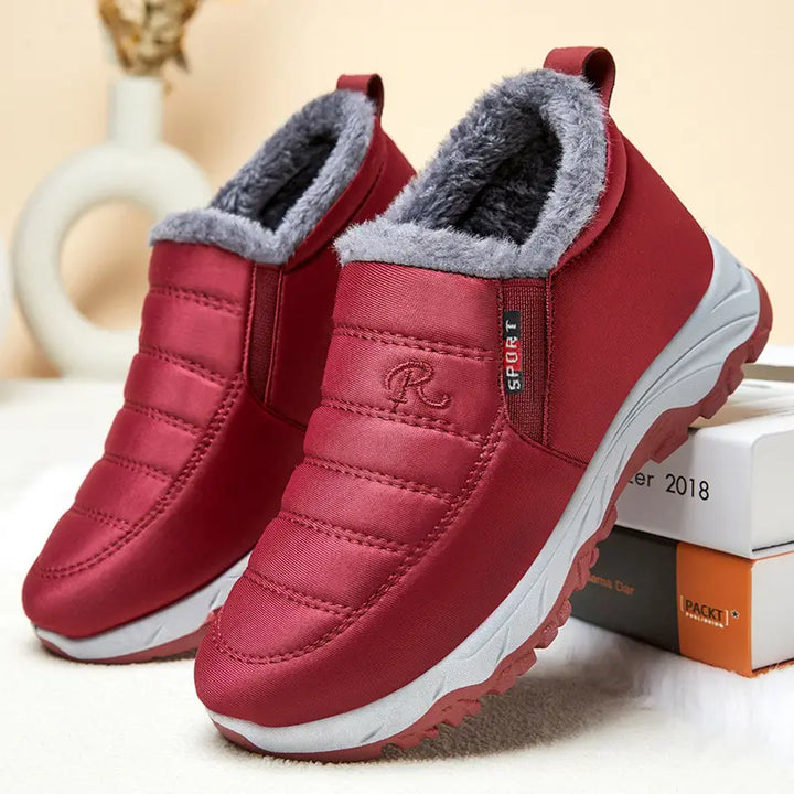 Pair of red quilted Zylpha winter boots with plush faux-fur lining, slip-on design, and visible &
