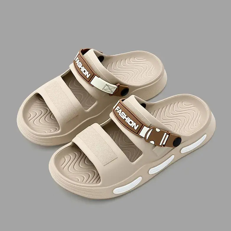 A pair of light beige Rhyza chunky platform slide sandals with dual adjustable straps featuring embossed &