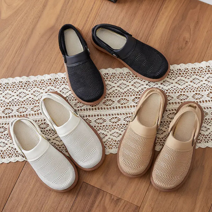 A flat-lay arrangement of Rovak breathable mesh slip-on mules in black, light grey, and beige, displayed on a wooden surface with a decorative lace runner.