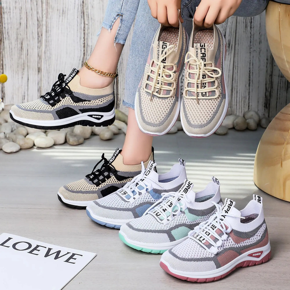 Women's Shalix breathable knit trainers in blush pink, white, mint green, and beige colorways, shown in a lifestyle studio setting with lace-up closure and distinctive sole detail.