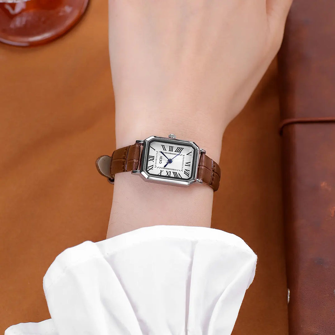 Tarkhan elegant rectangular watch with Roman numerals and blue hands, worn on a wrist with a brown embossed leather strap.