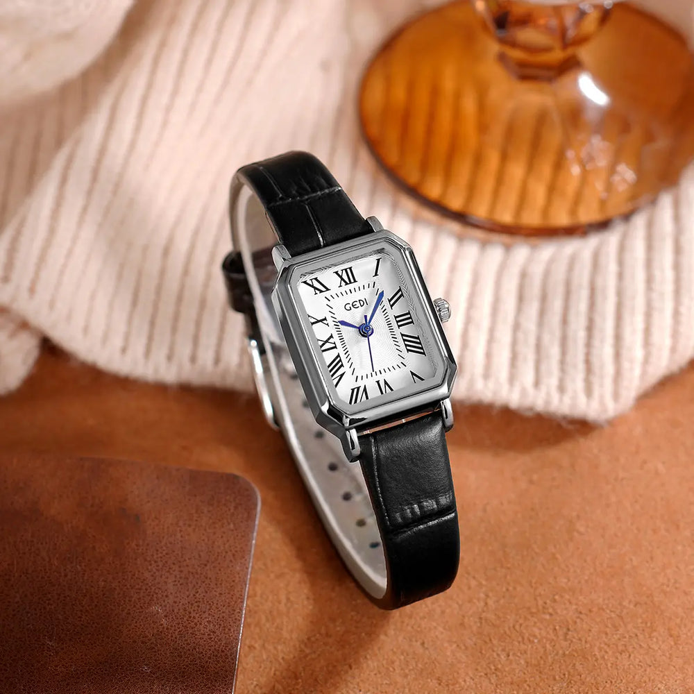 Tarkhan elegant rectangular watch with a white dial, blue hands, Roman numerals, and a black embossed leather strap, presented at a three-quarter angle.