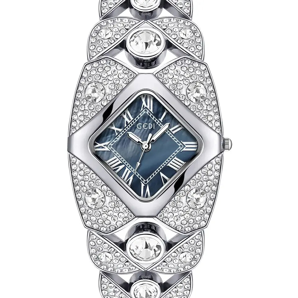 Silver-tone Tavril diamond-embellished bracelet watch with a rhombic blue mother-of-pearl dial and Roman numeral markers, displayed front view.