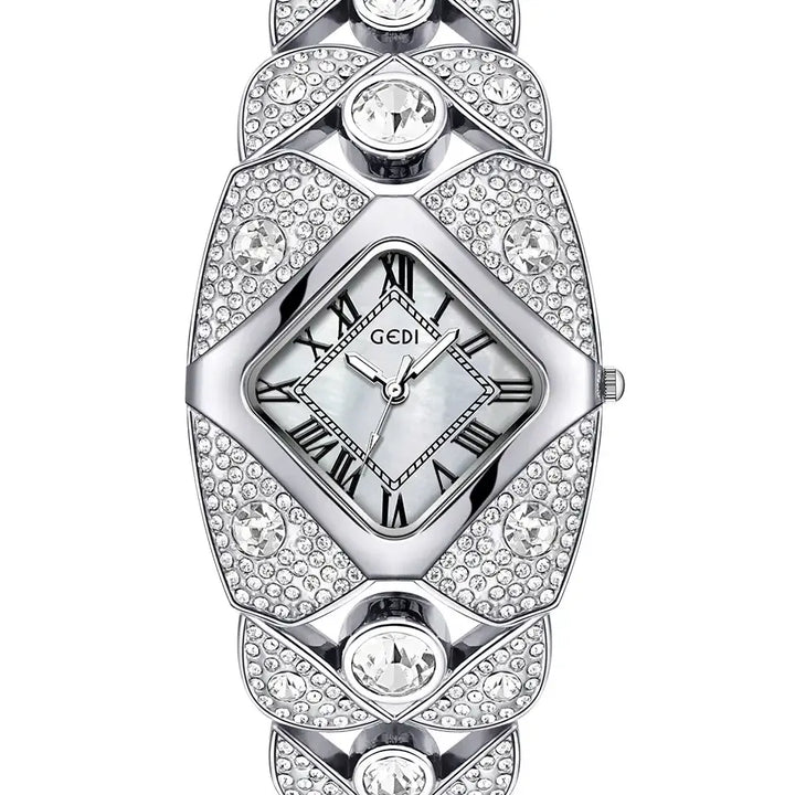 Silver-tone Tavril diamond-embellished bracelet watch with a rhombic dial and Roman numeral markers, showcased on a clean white background.