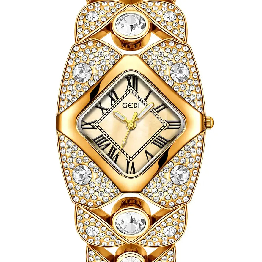 Gold-tone Tavril diamond-embellished bracelet watch with a rhombic case and dial featuring Roman numerals, presented on a white background.