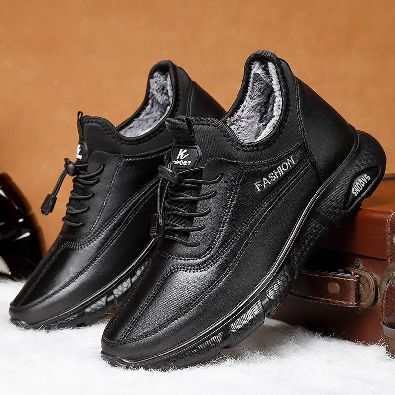 Men's black PU leather winter boots with plush faux fur lining, featuring white embroidered 'FASHION' on the side and 'SPORT' on the tongue, presented in a studio shot.