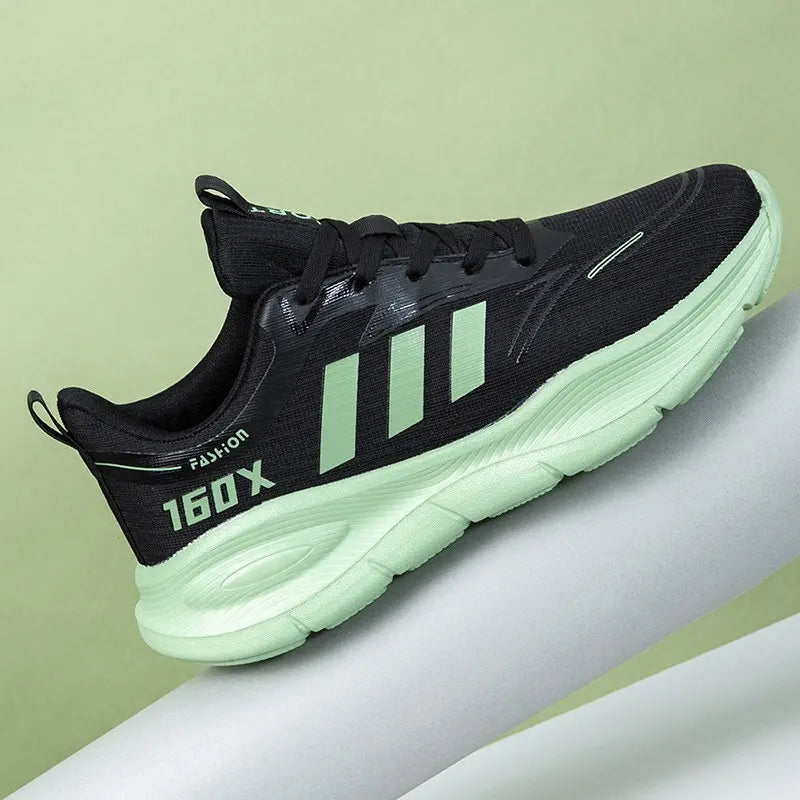 Black unisex low-top athletic sneakers with mint green stripes and sole, featuring &