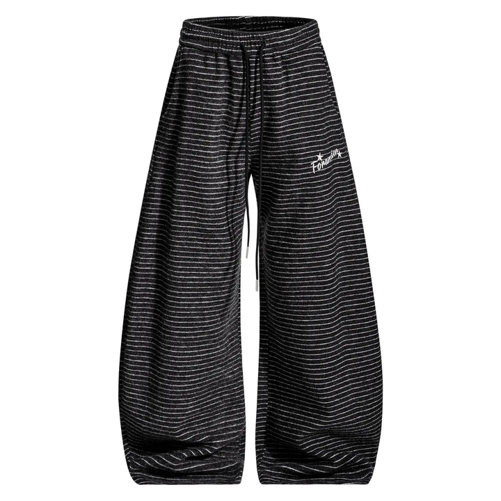 Vazel unisex charcoal black wide-leg knit trousers featuring fine white pinstripes, a high waist with a black drawstring, and a discreet embroidered hip logo, presented flat lay.