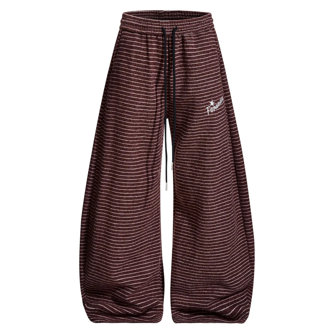 Vazel Retro Wide Leg Trousers in muted burgundy with fine white pinstripes, featuring a high waist, drawstring, and voluminous leg. These unisex pants offer vintage comfort and style.