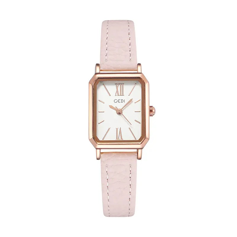 Elegant rose gold rectangular watch with a white dial featuring Roman numerals and baton markers, paired with a light pink faux leather strap with white contrast stitching.