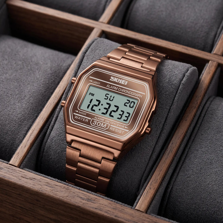Polished rose gold stainless steel Vexil retro digital watch with a bright blue illuminated display, front view.
