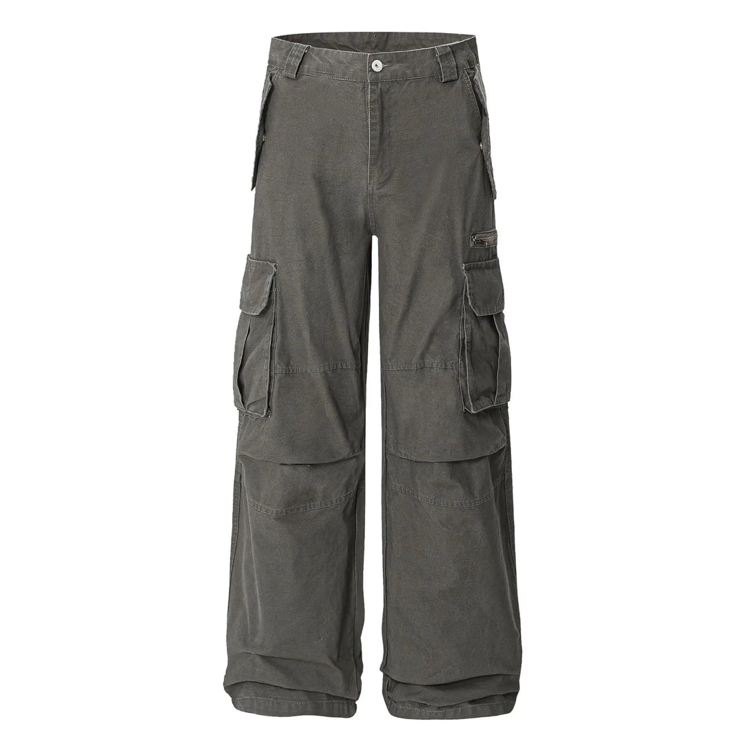 Vextar charcoal grey cotton cargo pants featuring a relaxed, wide-leg fit, mid-rise waist, button fly, and multiple functional pockets including a zippered thigh pocket. Presented flat lay.