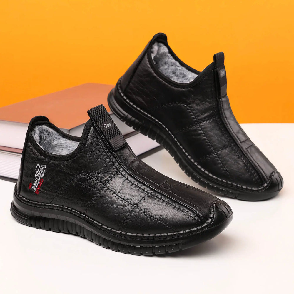 Wexel men's black quilted synthetic leather winter boots with plush faux fur lining, elasticated side gores for easy slip-on wear, and a durable lugged rubber sole.