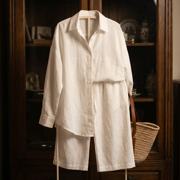Optical white linen-cotton blend relaxed shirt and wide-leg trousers set, displayed flat in a studio setting.