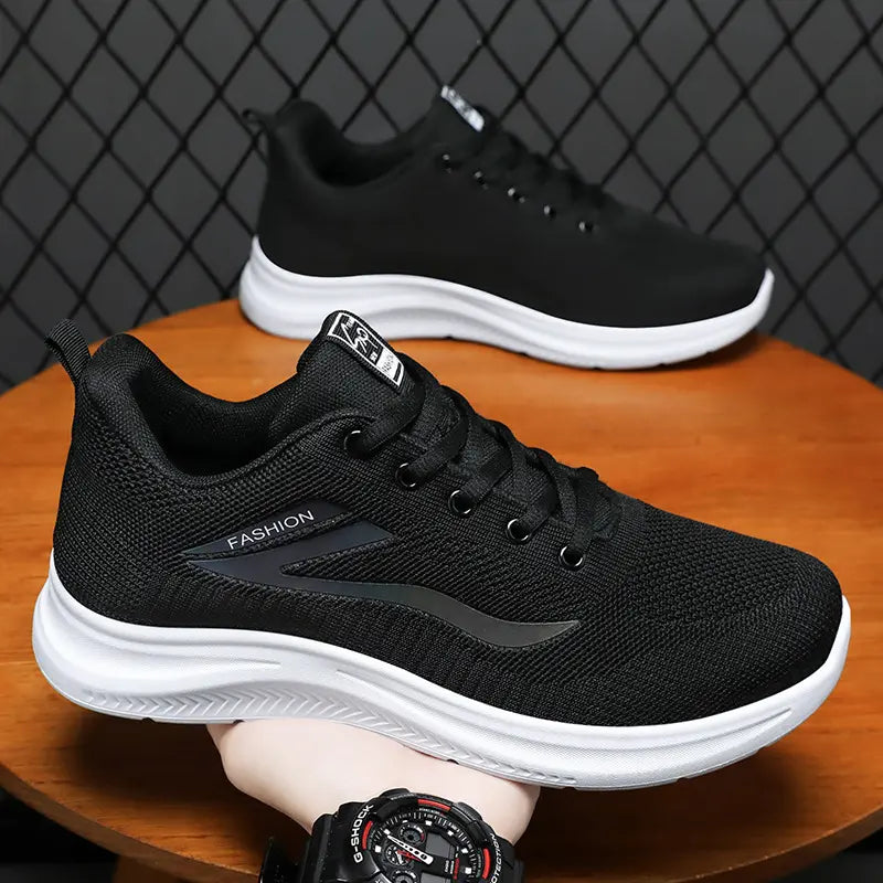 Men's Zaylon black breathable running sneakers shown from a three-quarter angle with iridescent 'Fashion' logo detail and white Phylon sole.