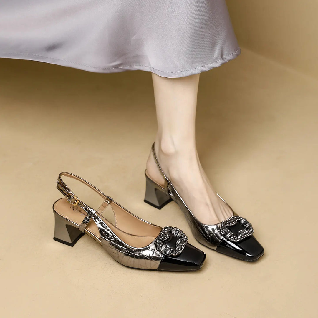 Zephra metallic slingback heels with square toe, crystal-embellished buckle, and chunky block heel, shown on a model&