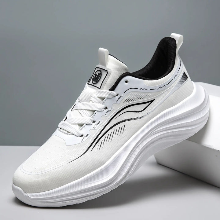 Zephyrin lightweight performance sneakers in pure white, showcasing a breathable engineered mesh upper and a sculpted white EVA sole from a three-quarter angle.
