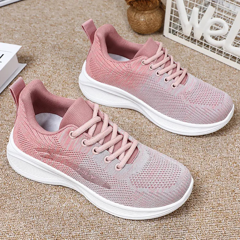 Zhyra women's knit sneakers in gradient pink and beige, featuring a rounded toe, lace-up closure, and a lightweight white Phylon sole, shown from a three-quarter side view.