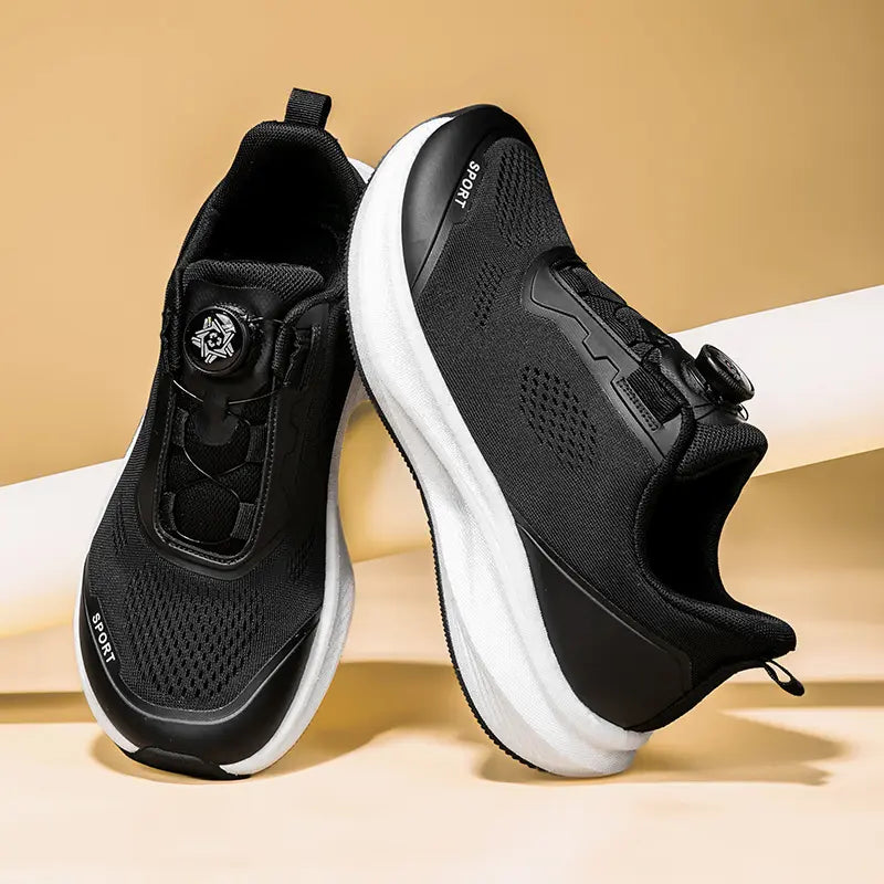Black men's Zovian running shoes with breathable engineered mesh upper and a white sculpted EVA midsole, featuring a rotary buckle closure and white 'SPORT' branding on the side.