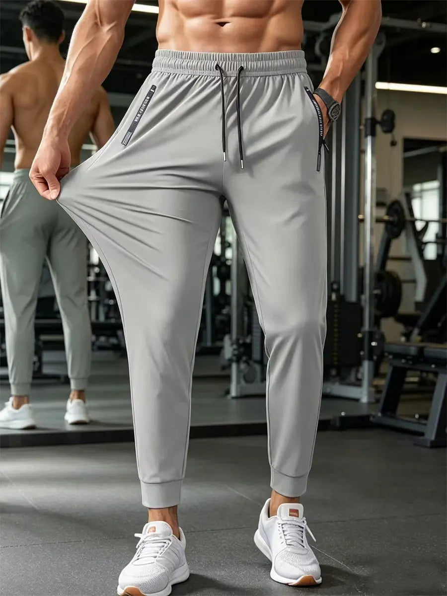 Man in a gym wearing grey Zydron men&