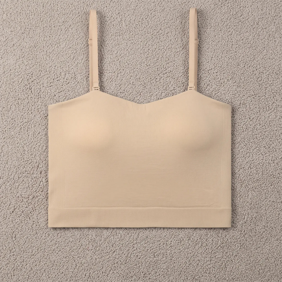 Seamless skin-tone camisole with built-in bra, featuring a square neckline and thin adjustable straps, presented front view on a white background.