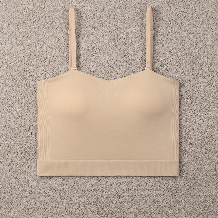 Seamless skin-tone camisole with built-in bra, featuring a square neckline and thin adjustable straps, presented front view on a white background.