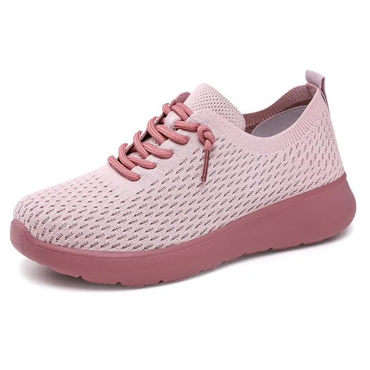 Dusty rose breathable knit trainer for women and men, featuring a lace-up closure, rounded toe, and cushioned foam sole for all-day comfort.