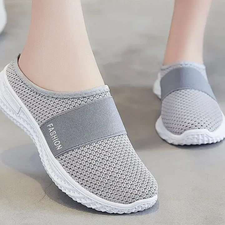 Grey slip-on mesh trainers with a &