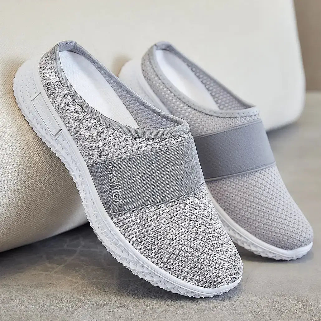 Grey slip-on mesh trainers with a &
