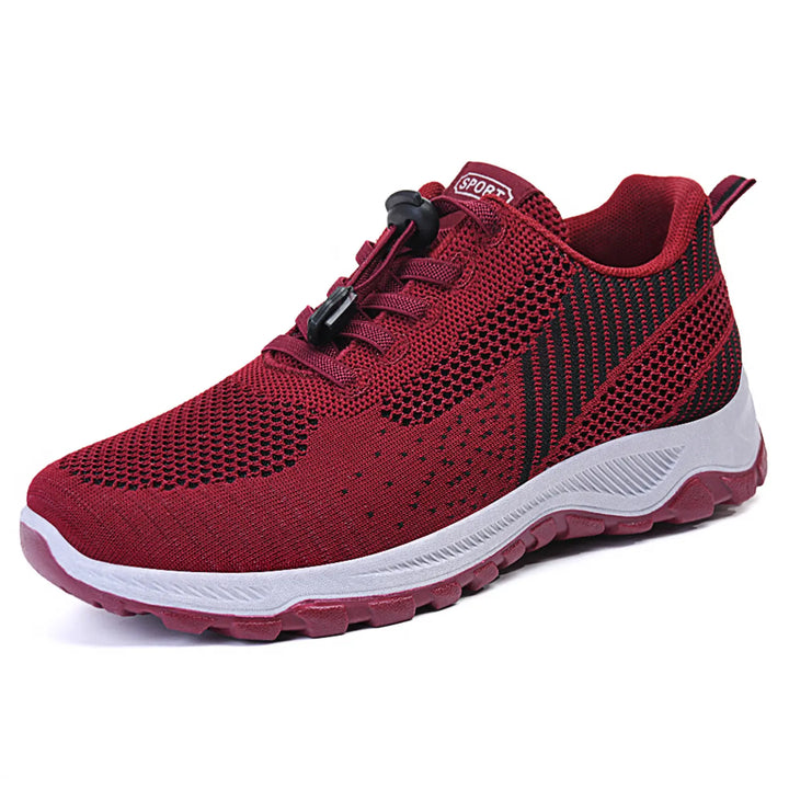 Zylos deep red lightweight walking trainers for men and women, featuring a breathable knit mesh upper with a quick-lace toggle system and a supportive rubber outsole.
