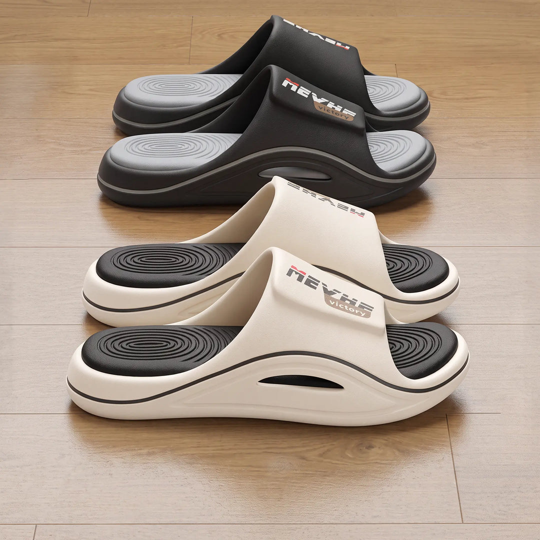 Two pairs of Zylos comfortable EVA slides, one in creamy off-white with a terracotta sole accent, the other in black. Both feature thick sculpted soles and textured wave footbeds, showcasing elevated casual style.