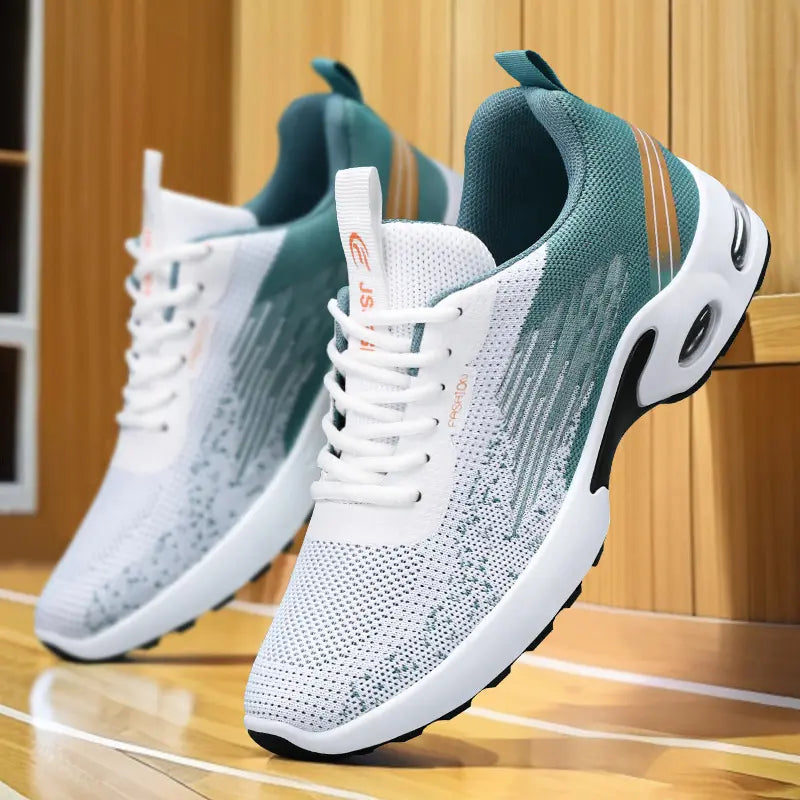 Zylos men's white breathable flyknit trainers with teal and grey striped accents and a visible air cushion sole, shown from a three-quarter angle on a wooden surface.