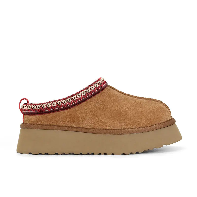 Zylos women's light tan slip-on platform boots shown from the side, featuring a decorative red, white, and beige woven band around the collar and a thick layered sole.