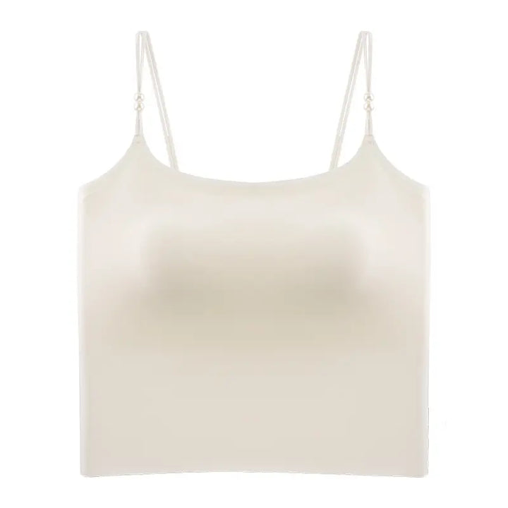 Zylovo seamless camisole in champagne white, featuring integrated 4cm molded cups, adjustable pearl-accented spaghetti straps, and a wide elasticated hem for sculpted comfort.
