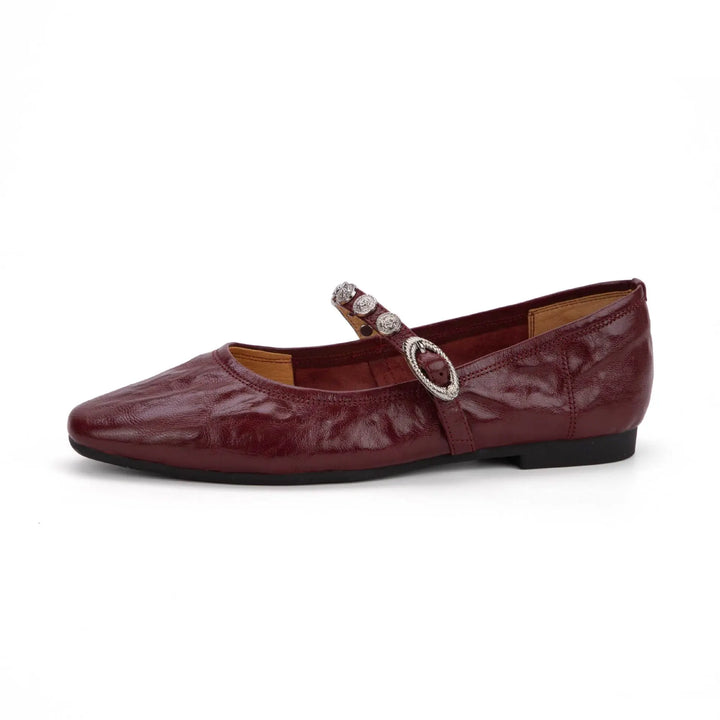 Dark coffee brown ruched lambskin leather Mary Jane flat shoe featuring a square toe, jeweled buckle strap, and flat sole.